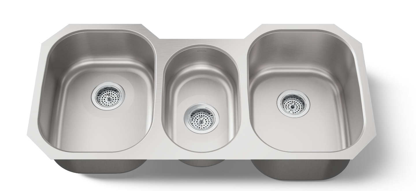 Stainless steel kitchen sink with three compartments on a white background