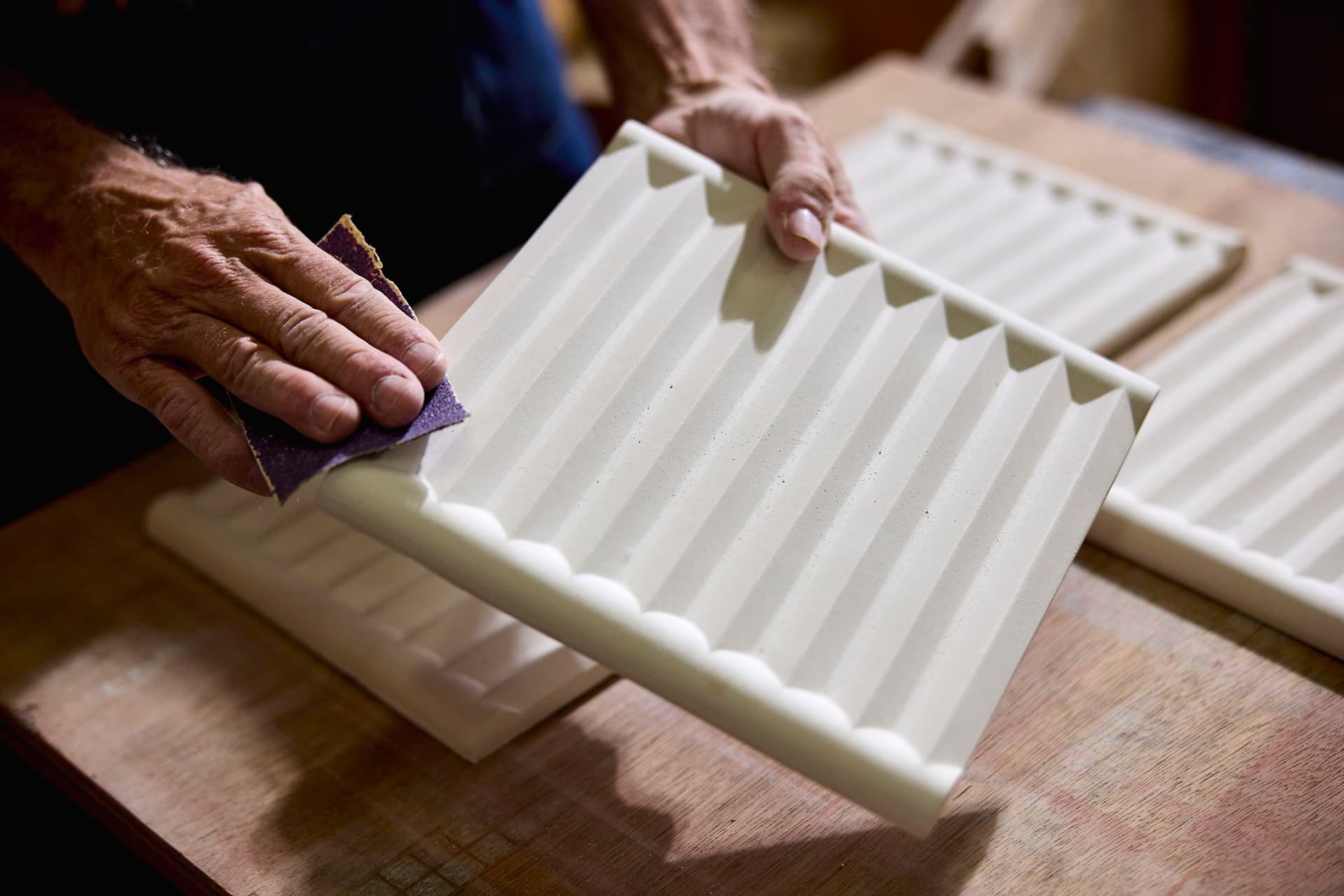Artisan handcrafting a Gem by Kelly Wearstler concrete tile