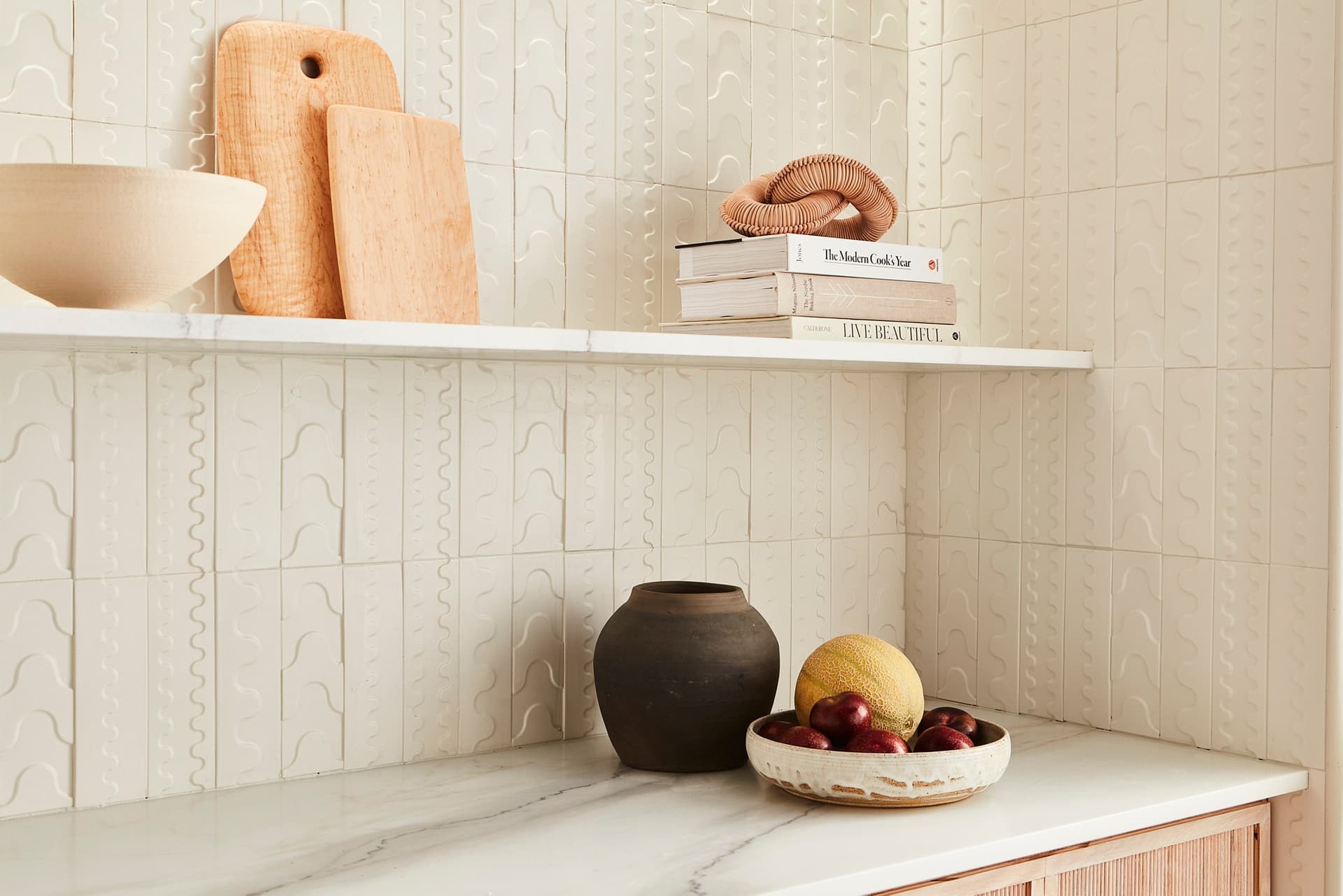 Gem by Kelly Wearstler Swell concrete tile backsplash in a kitchen