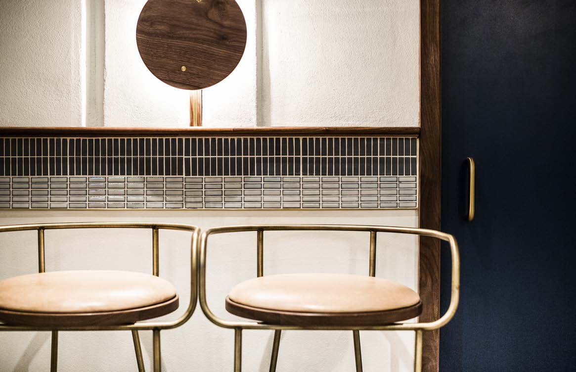 Savoy tile detail in a restaurant banquette setting