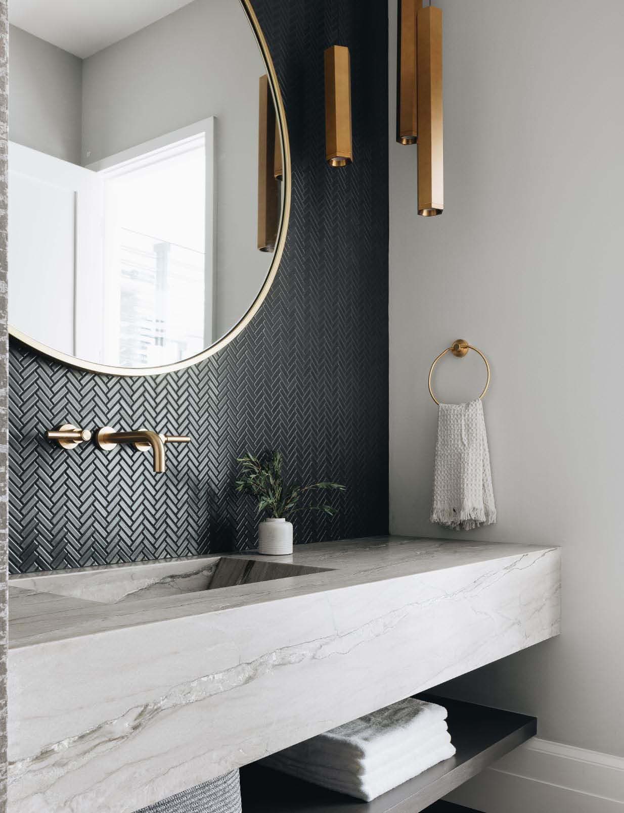 Savoy Classic Herringbone Mosaic in Graphite on a powder room vanity wall