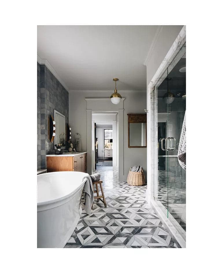 Ann Sacks Liaison Doheny stone mosaic floor in a marble bathroom