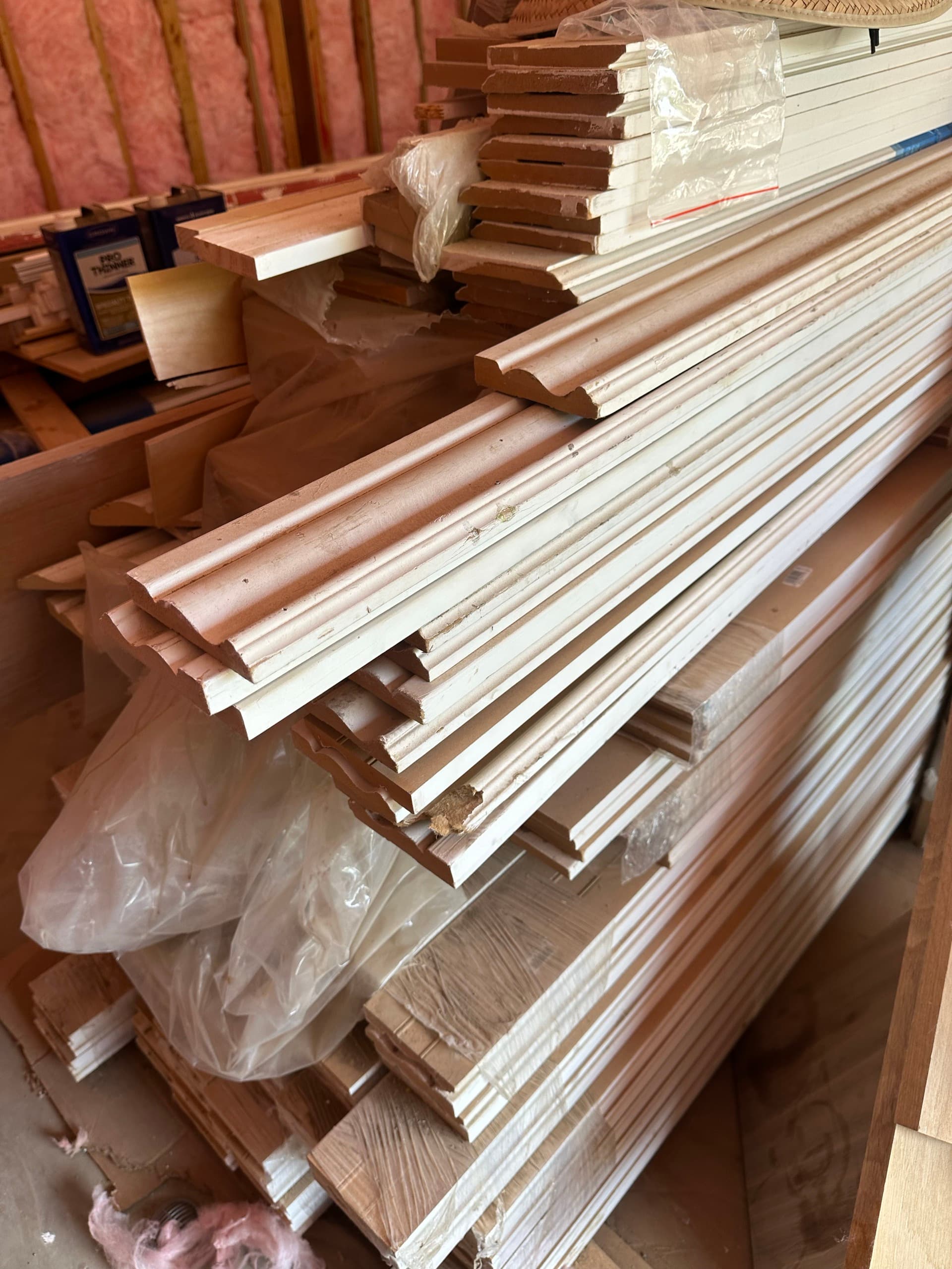 Bundles of new wood moulding and trim profiles