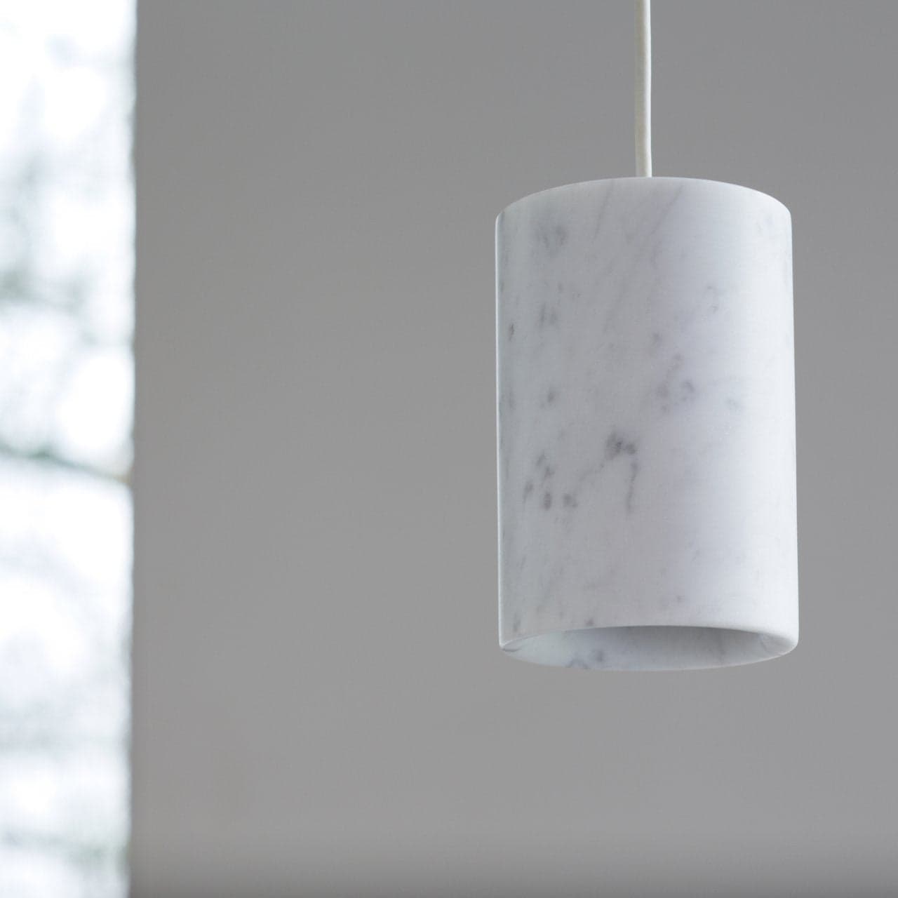 Terence Woodgate Solid Cylinder Pendant in white Carrara marble, 5.5" h x 3.5" d