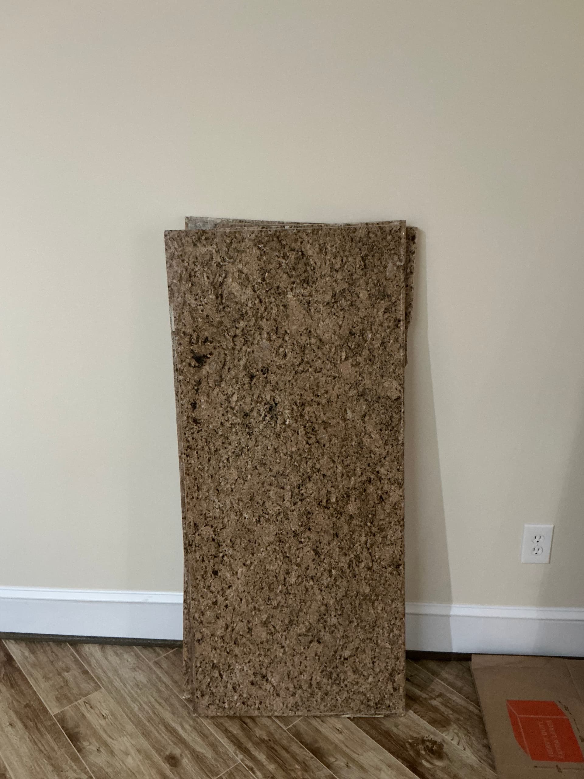 Giallo Veneziano granite slabs: two 51" x 22.5" remnants and one 9' x 25.5" piece with sink cutout