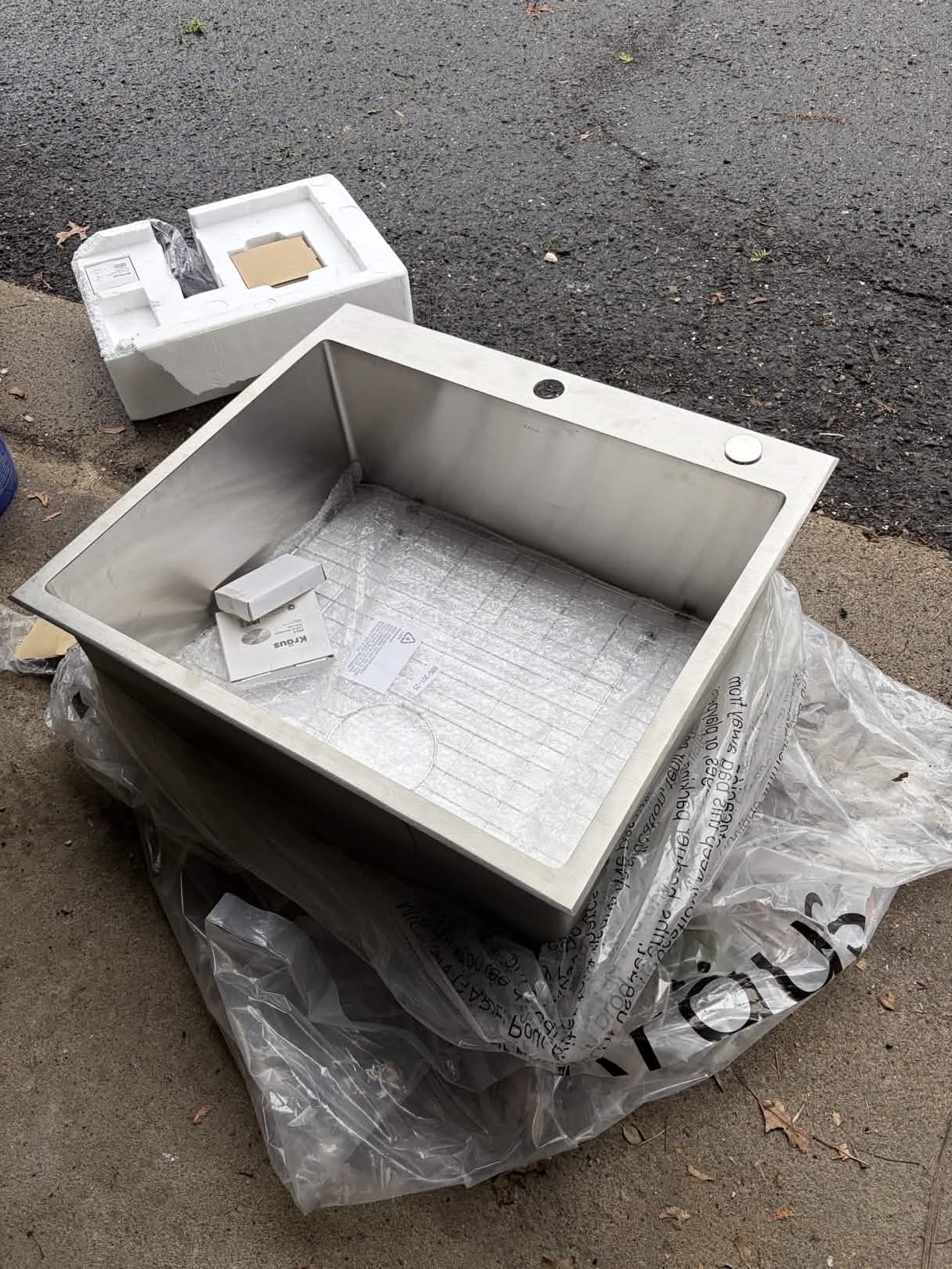 Kraus 25" Stainless Steel Undermount Kitchen Sink with mounting hardware and drain cap