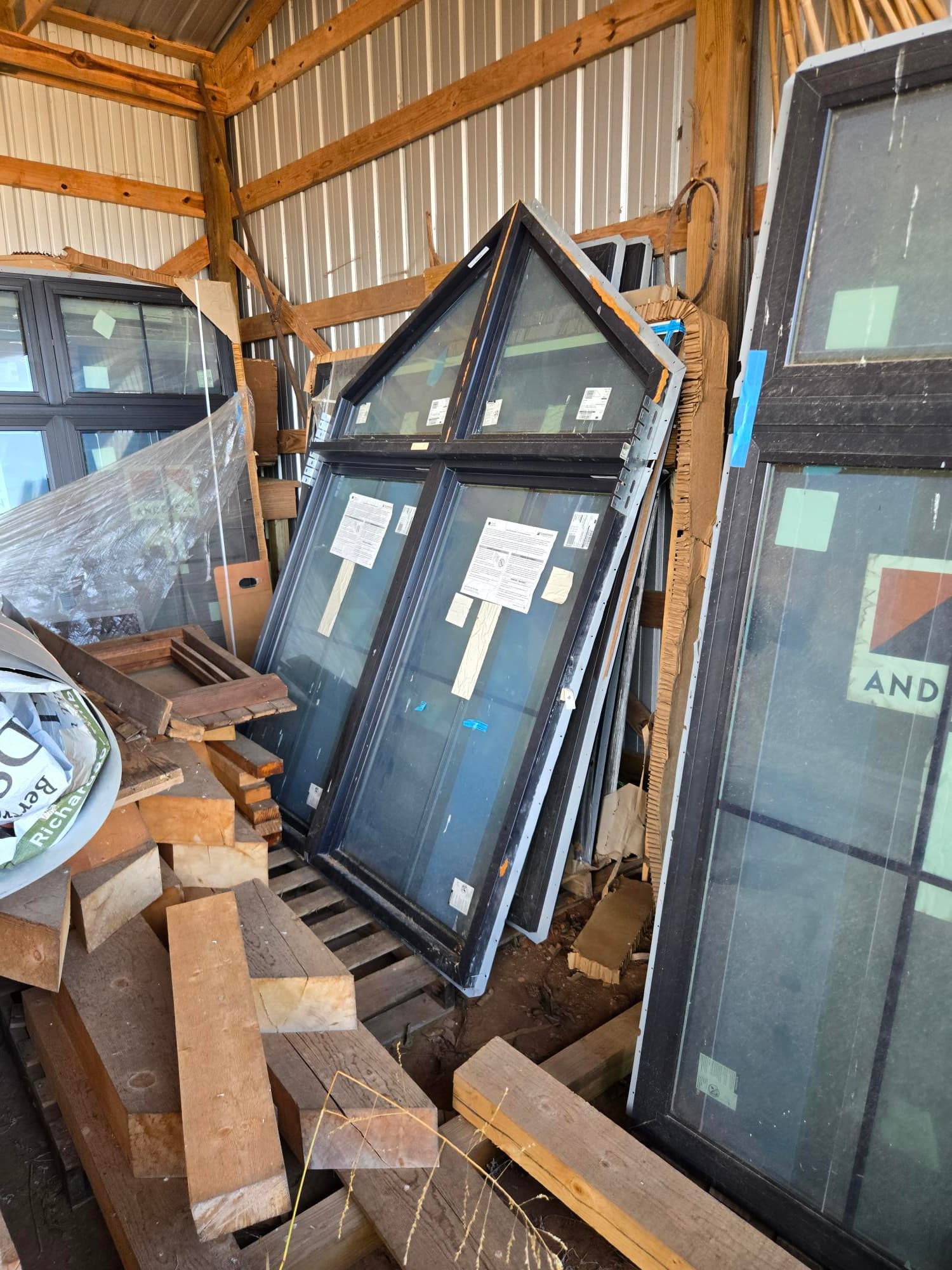 Andersen 100 Series double-pane low-E windows with black plastic frame, unused