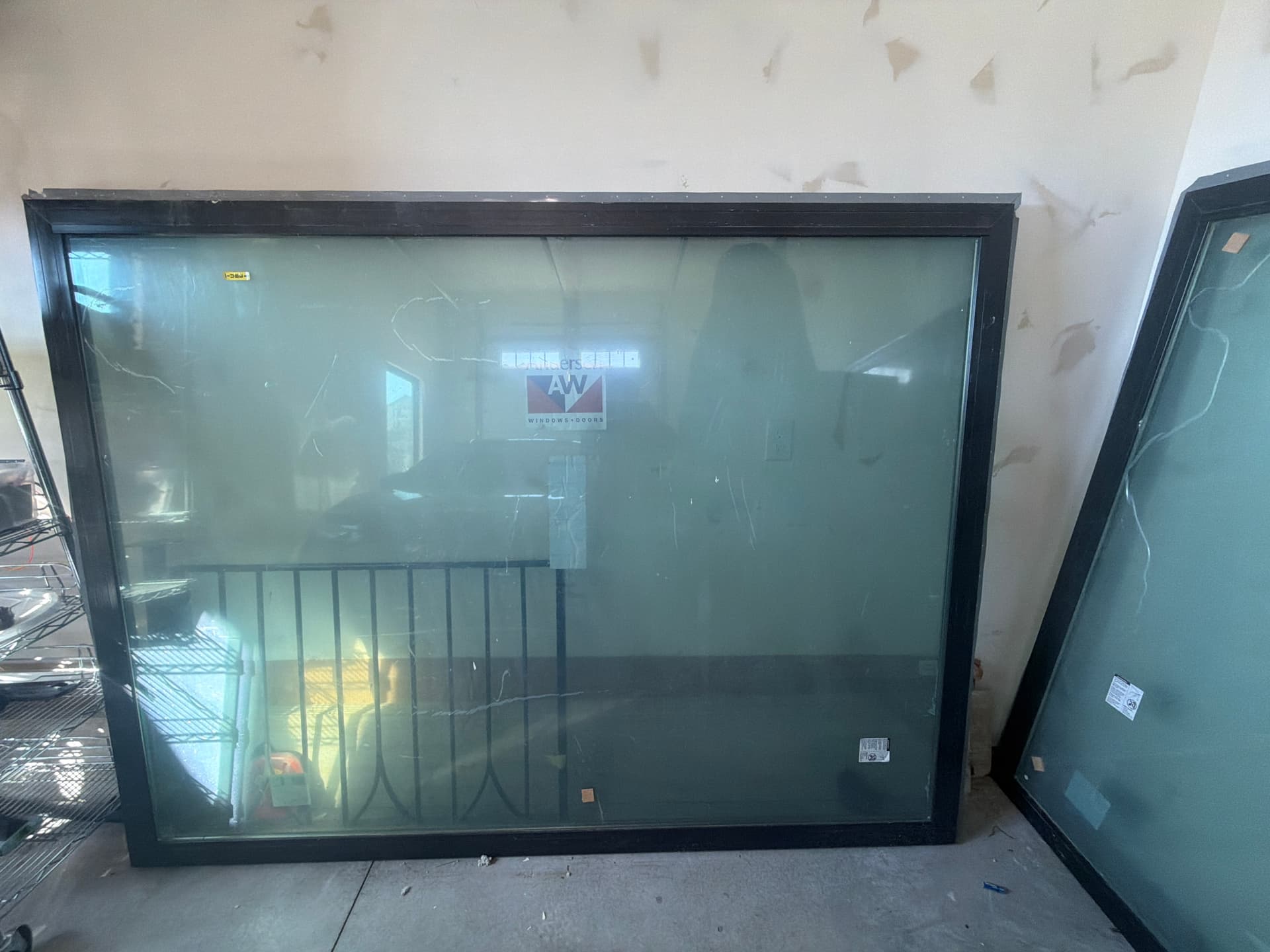 two brand-new Andersen 100 Series picture windows (8’×6’ and 6’×6’)