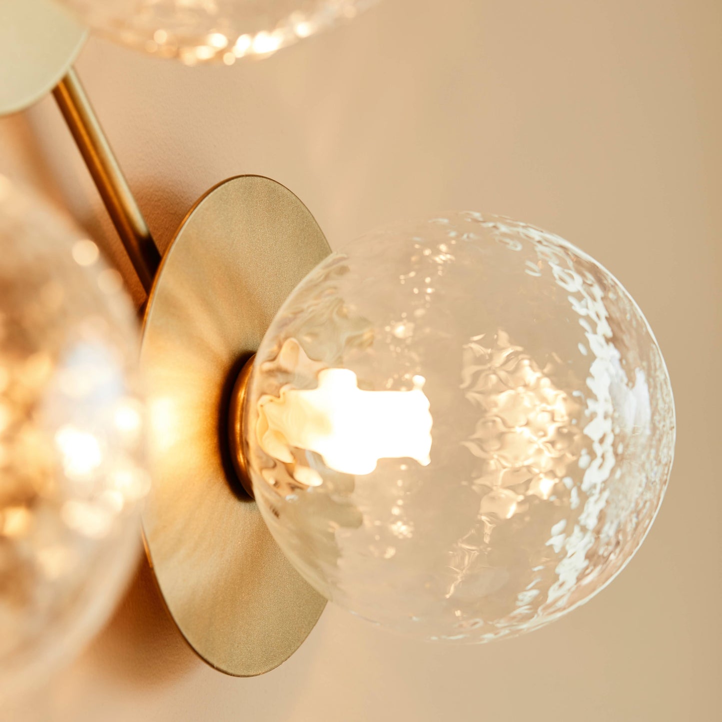 Nuura | Liila 1 Wall + Ceiling Lamp, Large - Nordic Gold/Optic Clear